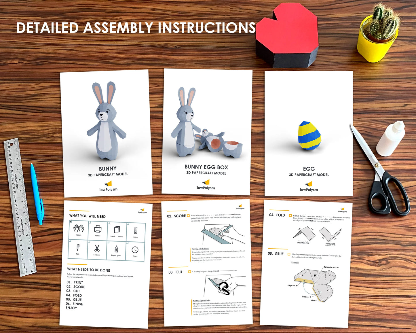 Assembly instructions for a bunny and egg box model on a wooden surface with tools and a plant.