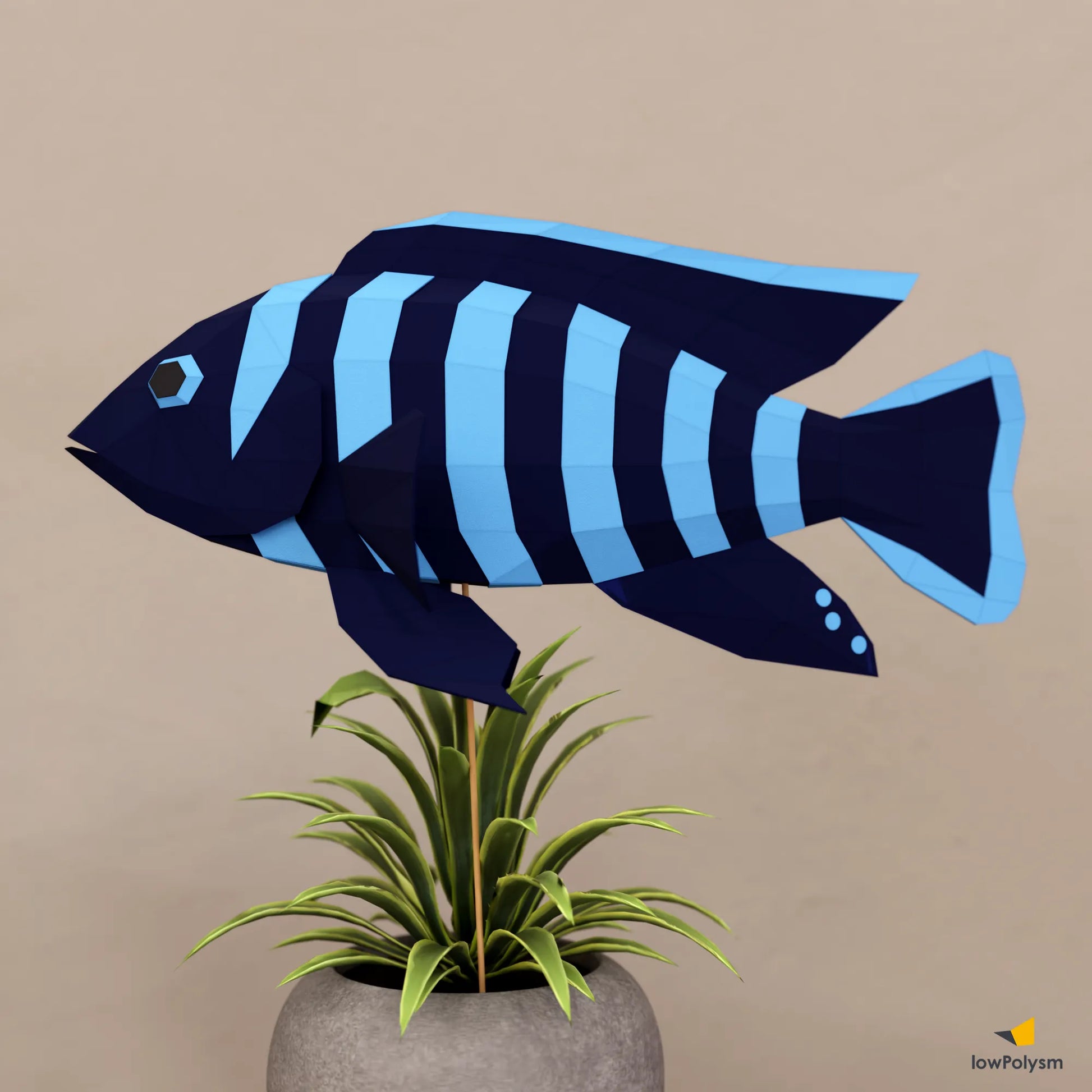 African Cichlid 3D papercraft fish displayed on desk with plant in the pot.