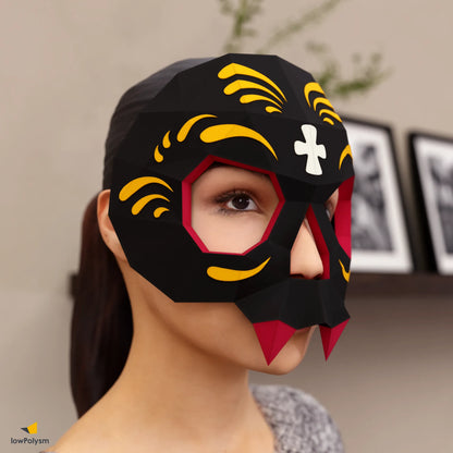 Black charcoal 3D sugar skull mask worn by woman, made from DIY papercraft templates.