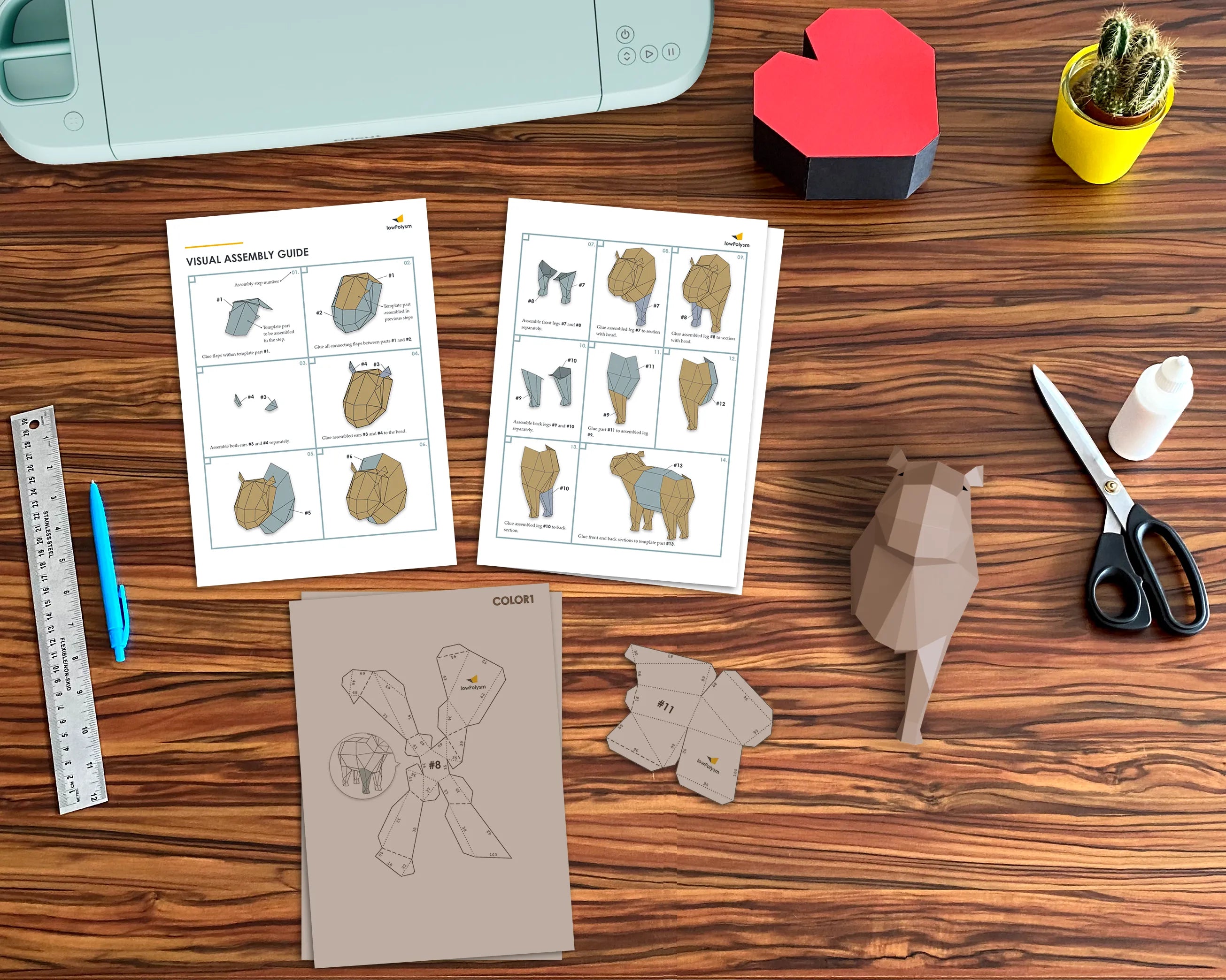 Paper capybara on the table with a visual assembly guide 