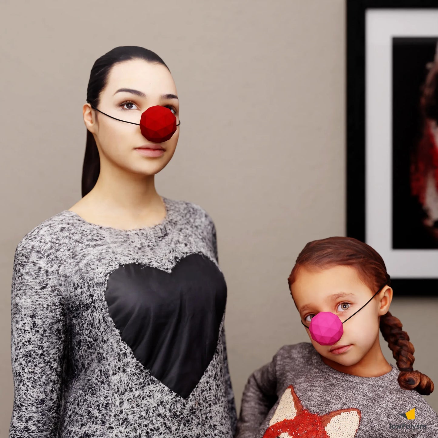 Woman and child wearing a large red and pink papercraft DIY clown nose masks