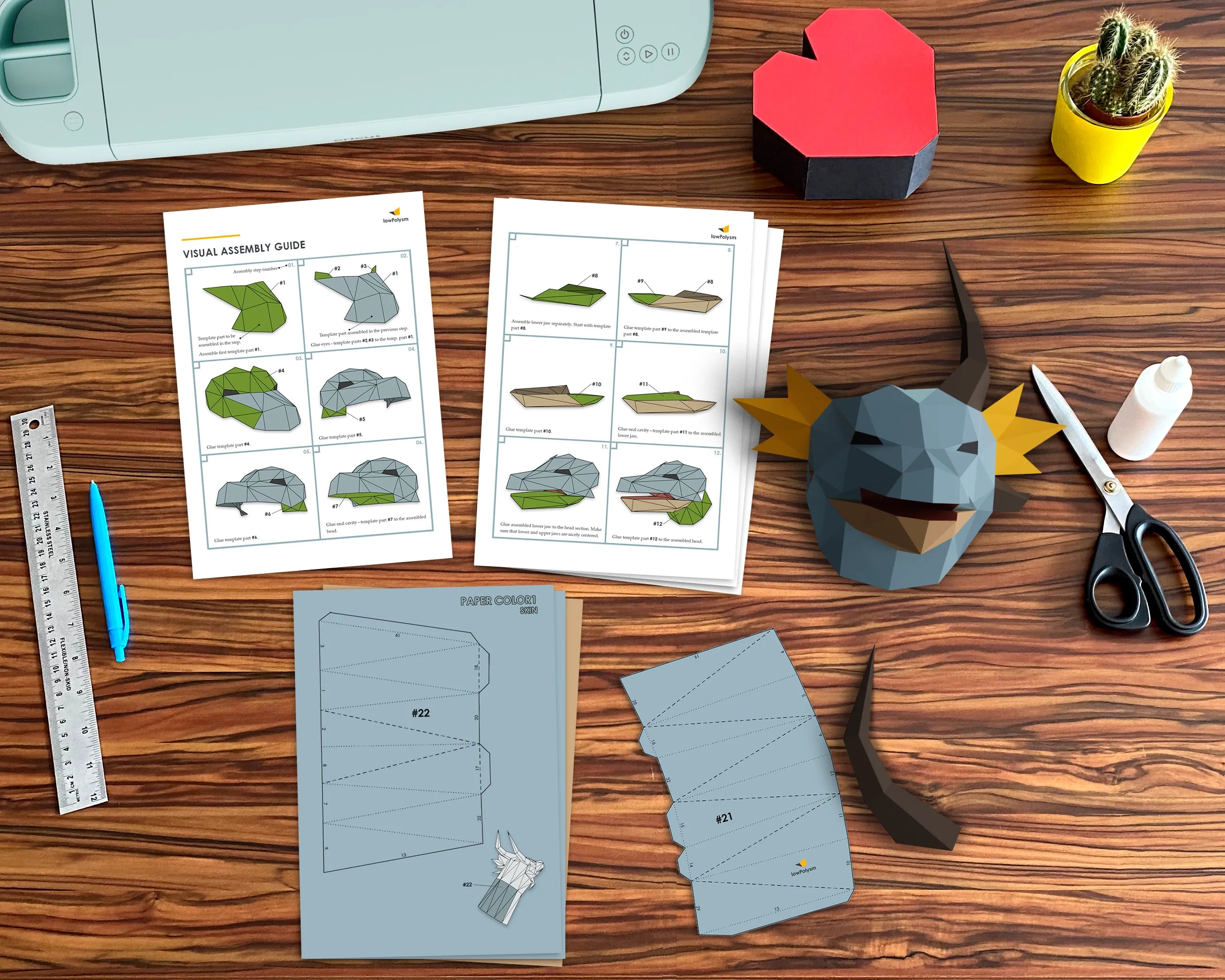 Dragon head papercraft on table with assembly guide
