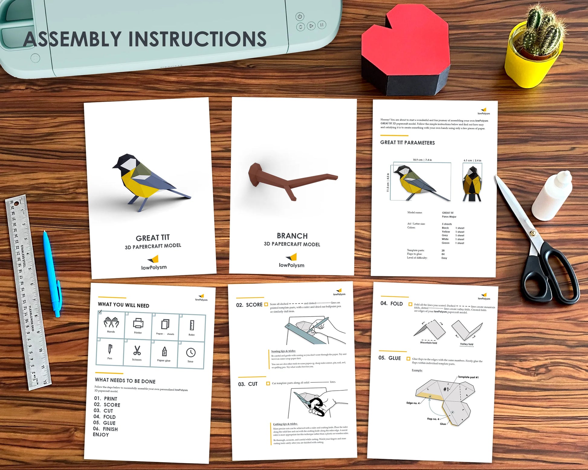 Bird paper craft printed assembly instructions on table