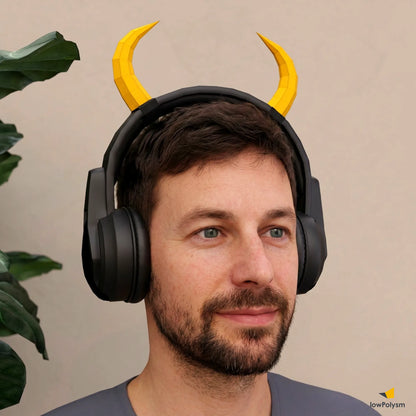 Man wearing headphones with paper DIY yellow horns 
