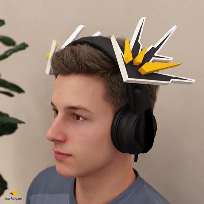 Male gamer wearing black gaming headset decorated with lowpoly yellow and black MECHA WINGS 3D papercraft attachment.