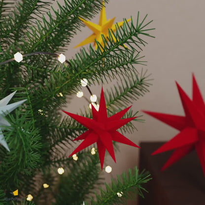 Christmas DIY paper star ornament, tree topper and freestanding paper craft stars in different colors and sizes.