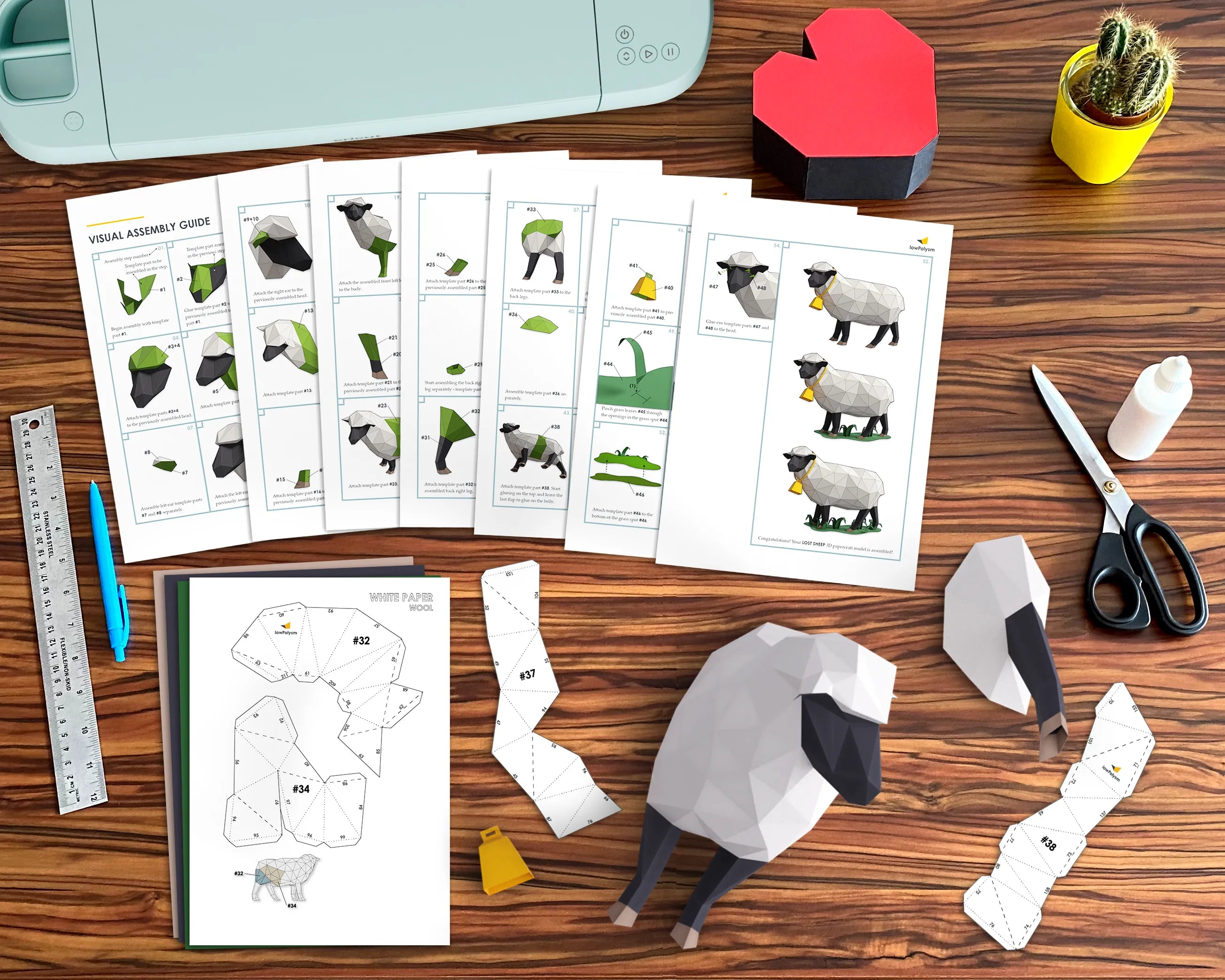 Sheep polygonal animal templates and  assembly guide on the table