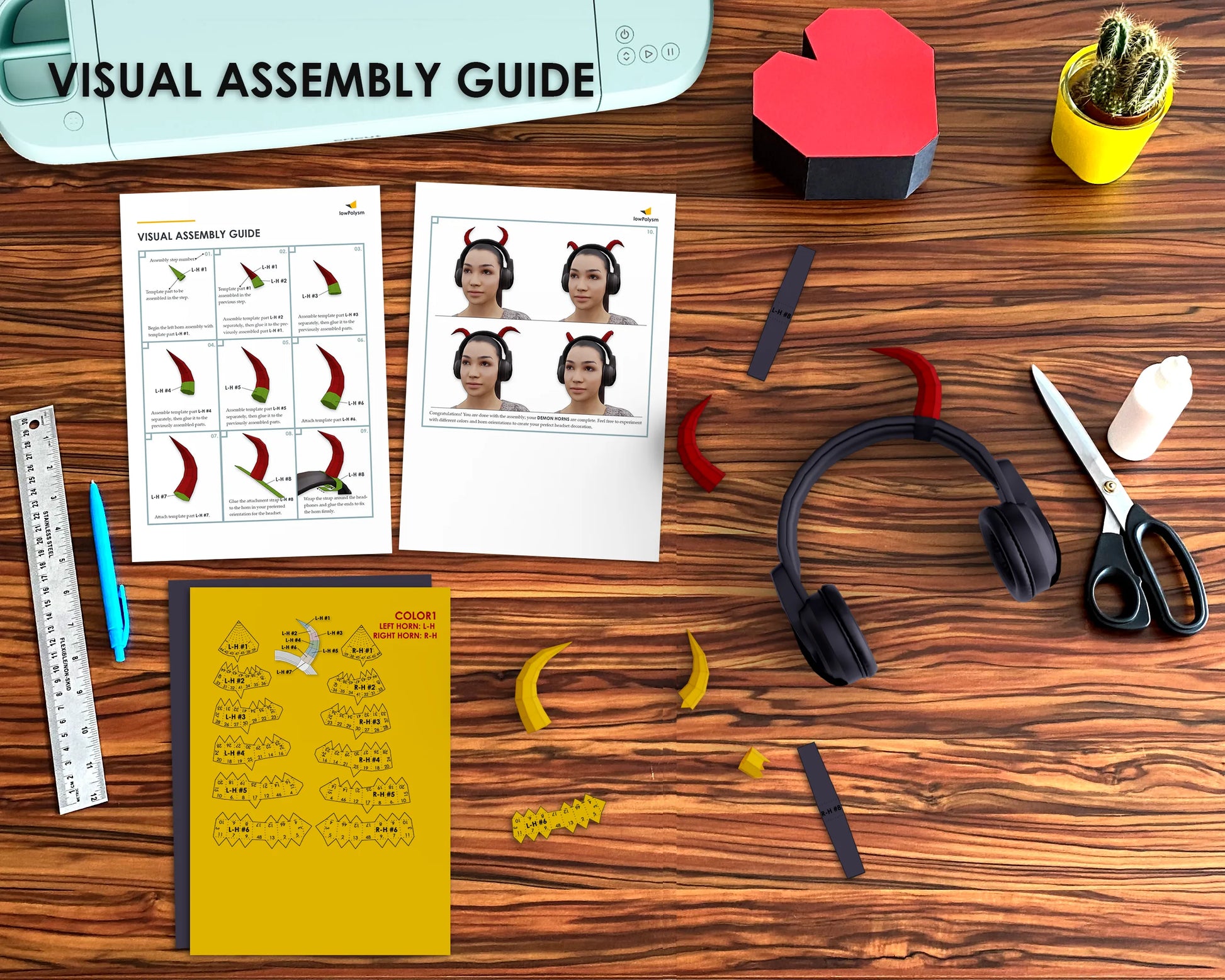 Crafting workstation with a completed headset mod, 3D papercraft horns, and assembly instructions.